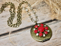 Brass round locket necklace embellished with red vintage earring