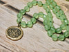 Bronze charm necklace hand knotted glass beads