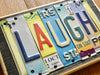 LAUGH Sign made with repurposed License Plates