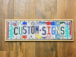 EXPLORE Sign made with repurposed License Plates