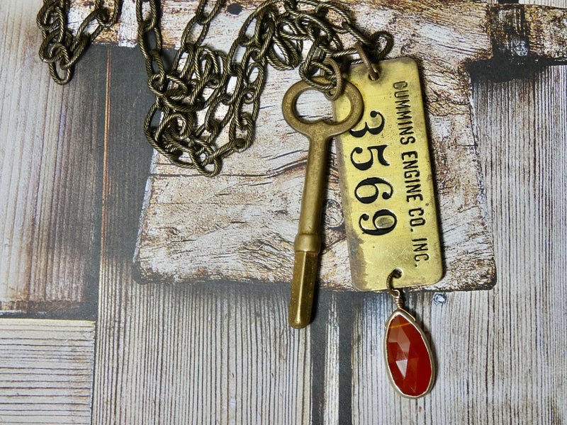 Vintage brass tag and key necklace Cummins Engine Tag #3569 and wind up key